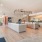 Leasing area of Lyra by Radius fitted with vinyl flooring, a business area, and high ceiling.