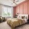 Bedroom in an apartment furnished with a queen-size bed, two nightstands, carpet flooring, wide windows, and high ceiling