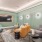Exclusive Cinema lounge area fitted with an on wall flat screen tv, couch seating, coffee table, carpet flooring, and high ceiling